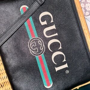 Authentic large Gucci wristlet pouch.  Certificate of authenticity pictured.